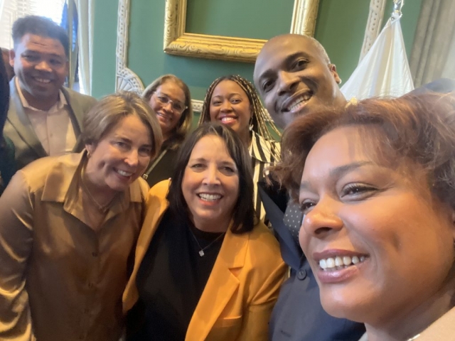 A selfie taken by our President and CEO, Dr. Hans Patrick Domercant, alongside Governor Maura Healey, Lieutenant Governor Kim Driscoll, and other Caribbean leaders.